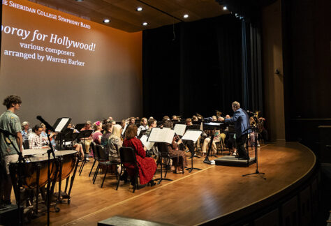 Photo of the Sheridan College Symphony Band performing during the Spring POPS concert in 2024.