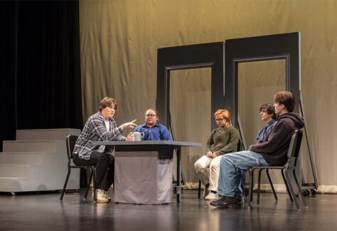 Several Sheridan College Theater students on stage during a scene