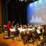 Eric Richards conducts during Holiday Swing performance photo