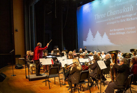 Eric Richards conducts during Holiday Swing performance photo