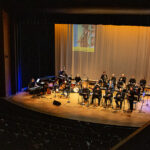 Photo of the Bighorn Jazz Orchestra performing on stage in Kinnison Hall