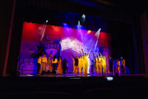 dramatically lit scene during the performance of chess the musical