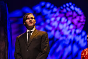 close up of actor during musical performance