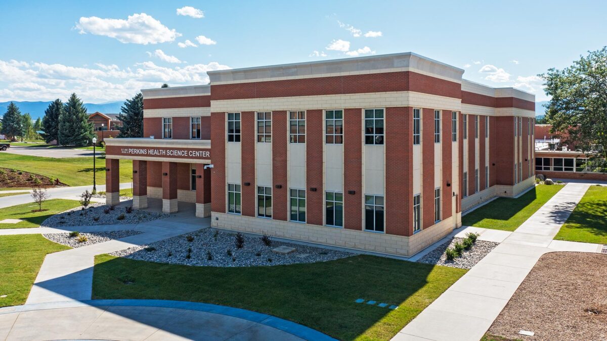 Perkins Health Science Center at Sheridan College with the Bighorn Mountains in the background.