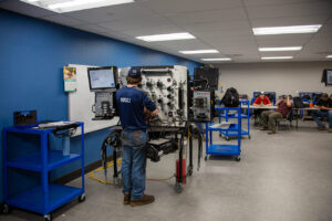 Photo of Sheridan College Diesel Tech student in the Hydraulic Lab.