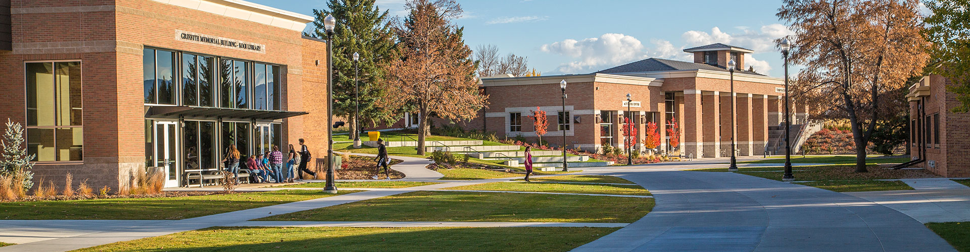 Sheridan College campus view from Whitney Mall with students gathered in front of the Griffith Memorial Kooi Library Building