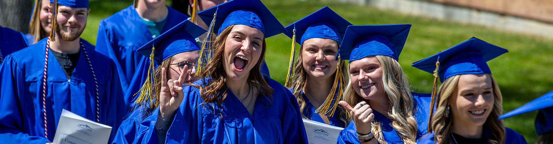 Sheridan College graduates celebrating before commencement.