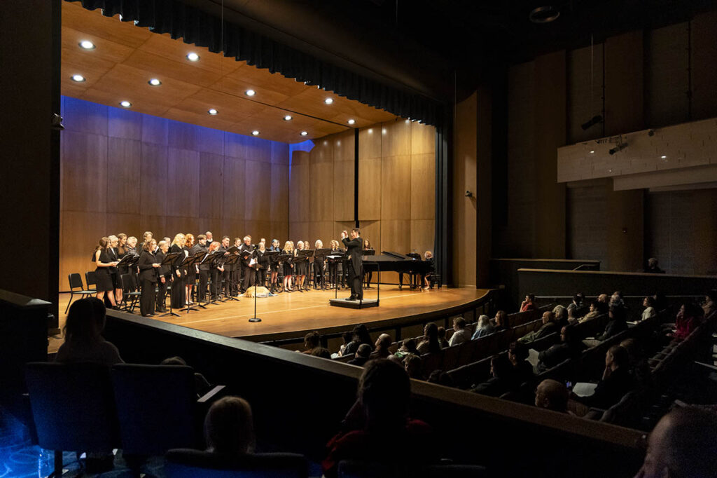 Colegiate Choir performing in Kinnison Hall