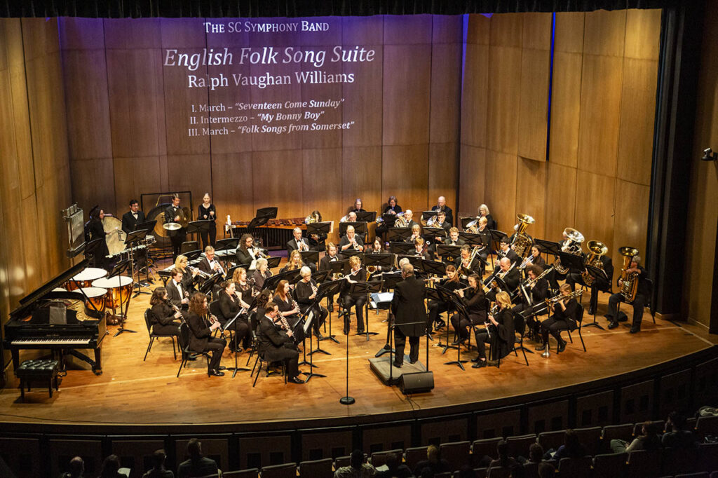 The Symphony Band of Sheridan College on stage, this is a full band with percussion and upwards of 25 members.